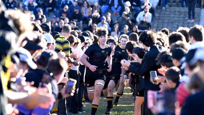 St Laurence run onto the field. AIC rugby game between St Edmunds college and St Laurence. Saturday June 11, 2022. Picture, John Gass