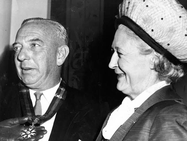 Arthur Rylah receives a CMG for outstanding service to the Legislative Assembly with his wife on the right. approx 1965