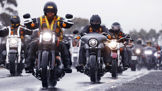 Bandidos members ride through the rain on their way up the freeway. Picture: Sam Ruttyn