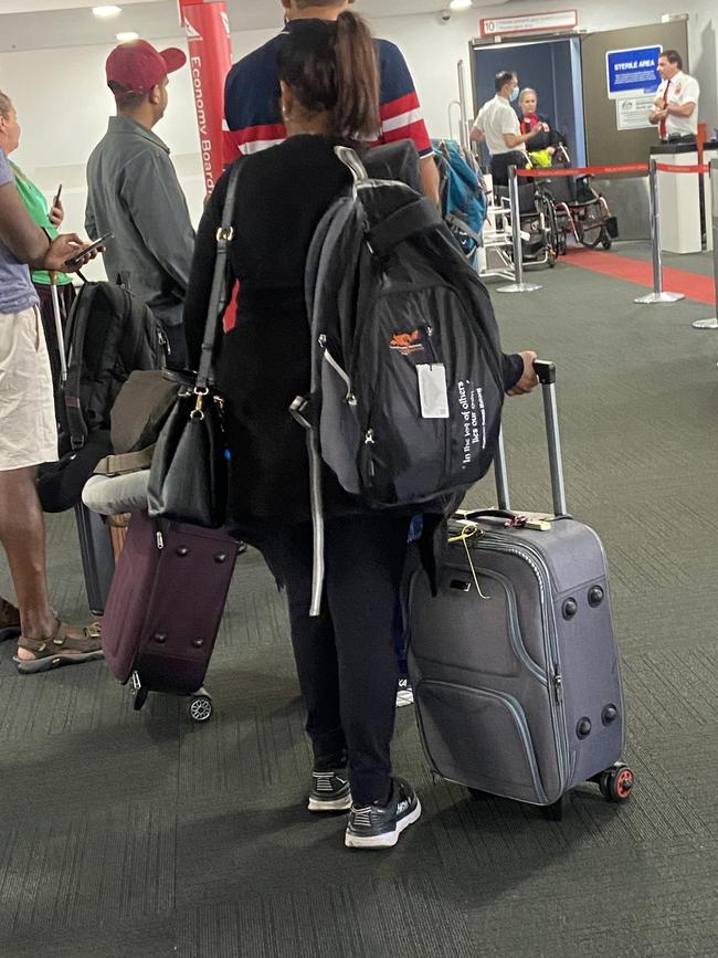 Another passenger boarding a plane.