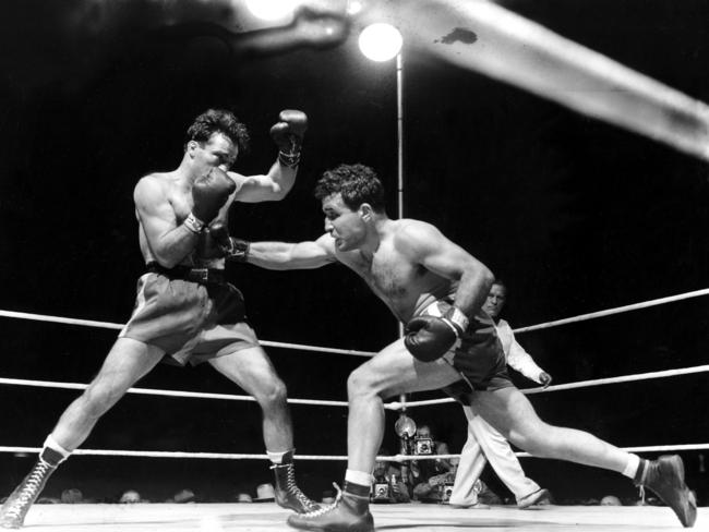 Jake LaMotta (right) fights Marcel Cerdan in Detroit, Michigan on June 16, 1949. LaMotta knocked out Cerdan in the 10th round to become the new World Middleweight Boxing Champion.