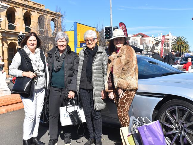 Gold Coast MG Car Club Members Cheryl Robinson, Faye Scheiwe, Bev Robinson, and Jonette Waller alongside Ms Waller's vintage Aston Martin at the Jumpers and Jazz Grand Automobile Show on July 18, 2021.