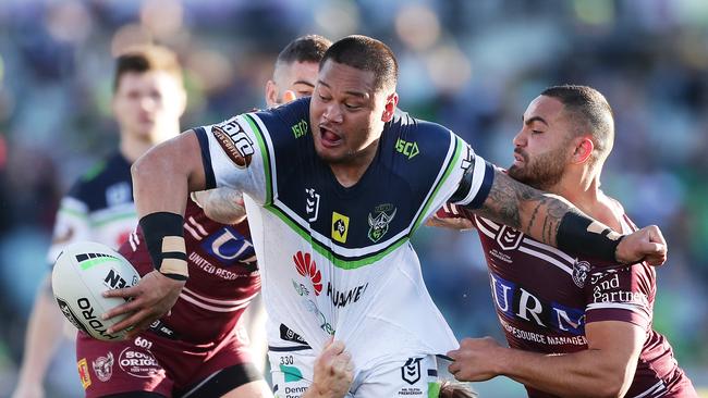 CANBERRA, AUSTRALIA — AUGUST 25: Joseph Leilua of the Raiders offloads the ball in a tackle during the round 23 NRL match between the Canberra Raiders and the Manly Sea Eagles at GIO Stadium on August 25, 2019 in Canberra, Australia. (Photo by Matt King/Getty Images)