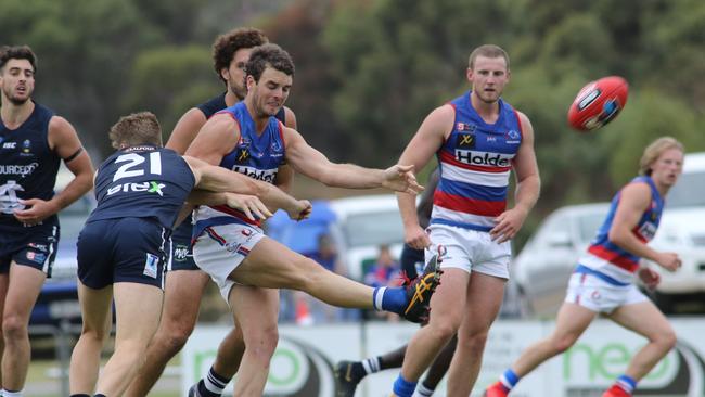 Jydon Neagle kicks clear for Central District. Picture: AAP Image/Russell Millard