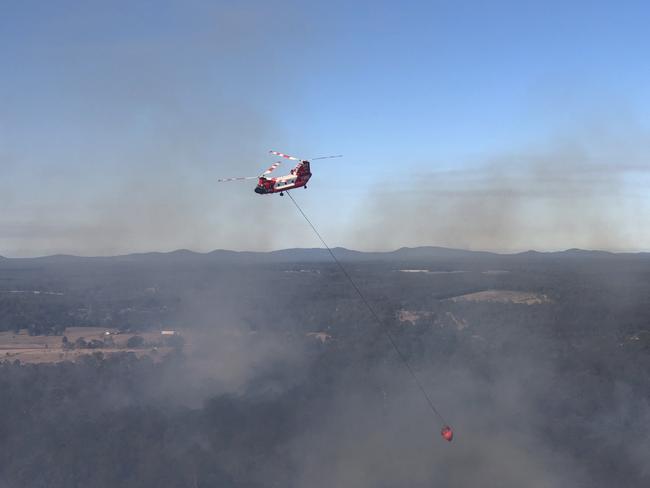 The RFS Chinook water bomber in action after arriving in Australia in July.