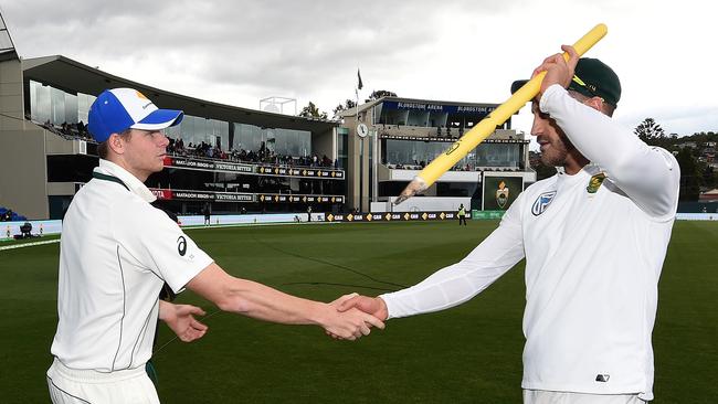 Australian captain Steve Smith shakes hands with Faf du Plessis after South Africa won the second Test in Hobart.