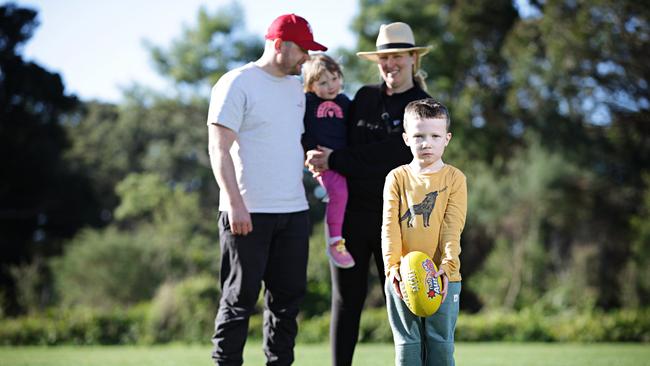 Clair Parker and Michael Parker with Edie, 3, and Owen, 6, enjoying the day at Sydney’s Centennial Park. Picture: Adam Yip