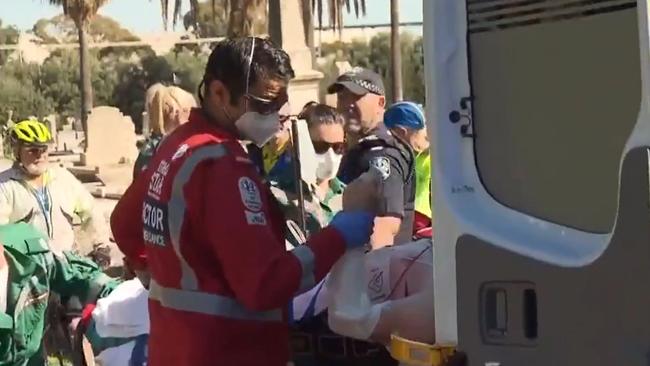 Paramedics with the cyclist, who was taken to the RAH in a critical condition. Picture: 7NEWS