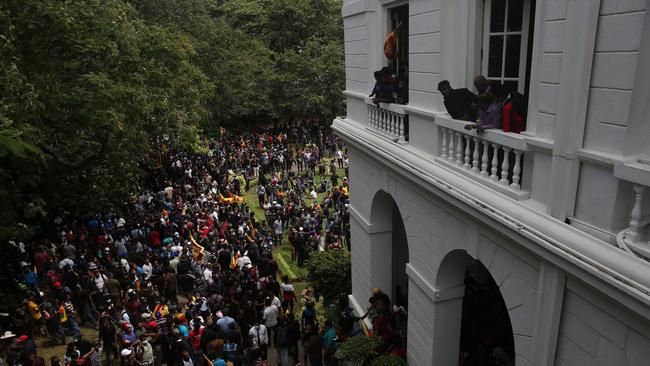 Protesters gather inside the premises of Sri Lanka Presidential Palace to demand the resignation of Sri Lankan President Gotabaya Rajapaksa on July 9 in Colombo.