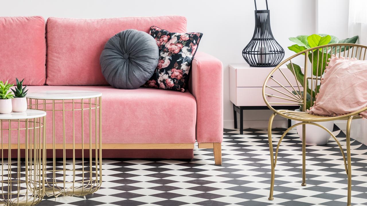 A pink sofa, golden armchair and tables, paired with black and white checkered tiles. But is everything as it seems or are your eyes playing tricks on you? Picture: Istock