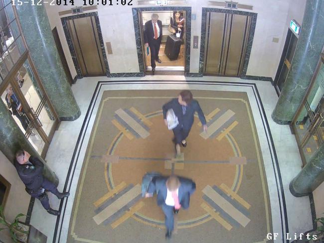 CCTV footage showing Senior Constable Paul Withers interacting with Marcia Mikhael at the Lindt Cafe in Martin Place as unwitting businesspeople pass by..