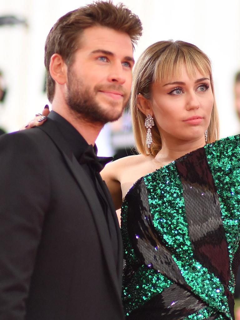Liam Hemsworth and Miley Cyrus at one of their final public appearances as a couple — at the Met Gala, in May. Picture: AFP