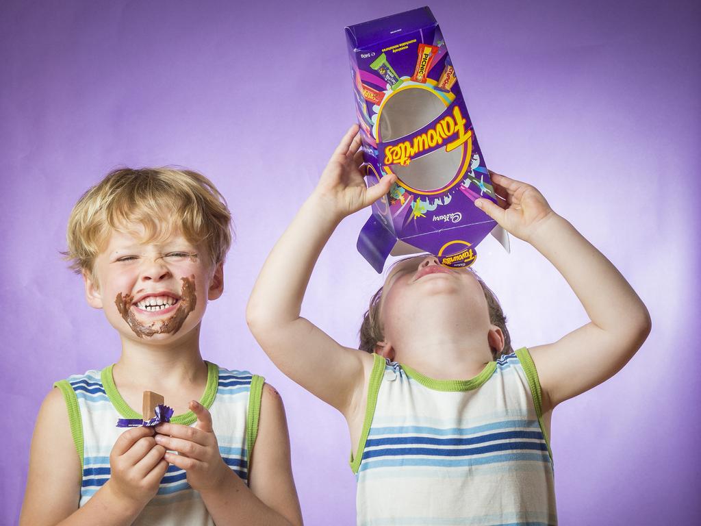 Twins Heath and Owen Fahey know where it’s at ... in a box of Favourites. Picture: Jason Edwards