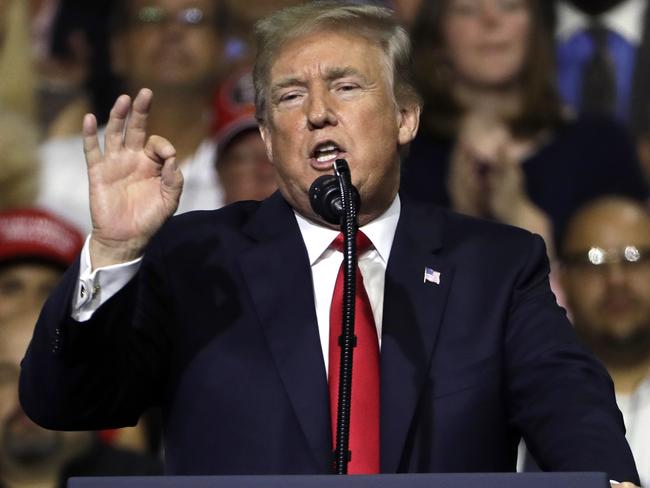 President Donald Trump gestures during a rally Tuesday, July 31, 2018, in Tampa, Fla. (AP Photo/Chris O'Meara)