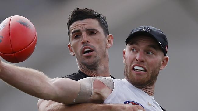 MELBOURNE , AUSTRALIA. March 7 , 2024.  AFL . Collingwood training at Olympic Park.    Tom Mitchell and Scott Pendlebury battle during todays session at Olympic Park       . Pic: Michael Klein