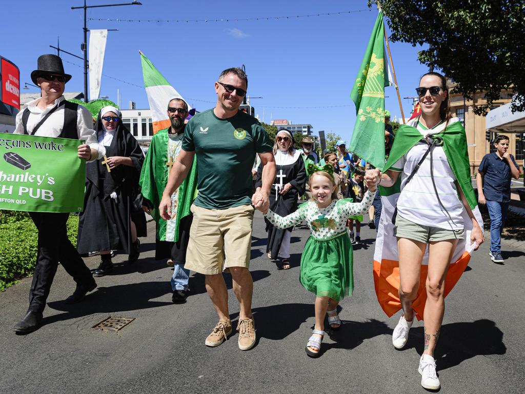 Marching in the Darling Downs Irish Club St Patrick's Day parade are (from left) Derek Barker, Orla Barker and Meaghan Moore, Sunday, March 16, 2025. Picture: Kevin Farmer