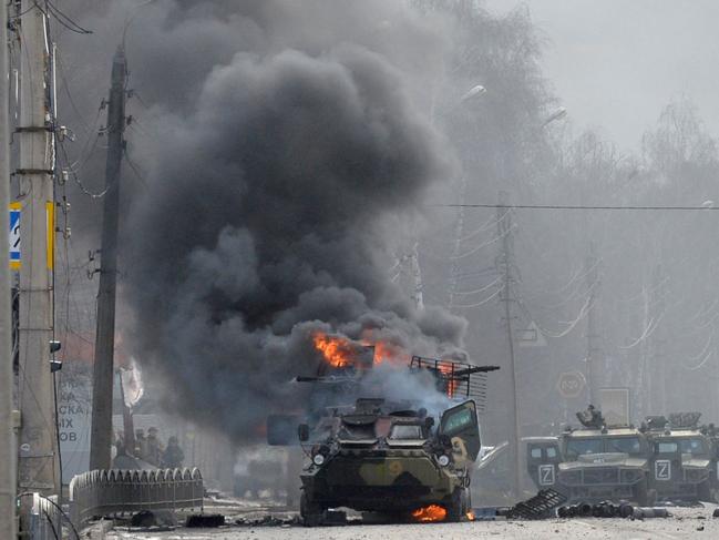 A Russian Armoured personnel carrier burning following street fighting. Picture: AFP