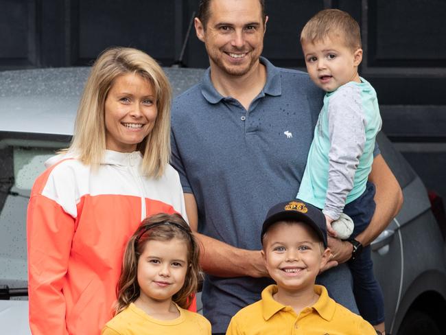 Portraits of The Lawrence family and their car taken outside their home in Leichhardt, Sydney, on 19th March 2021.Pictures are Dad Rob Lawrence; Mum Flora Lawrence; and kids Poppy (8); Freddie (5); and Rory (2) Lawrence.Smart Daily Cover - how to save on car insurance- the case family study used a comparison site to save on their insurance policy. (Pictures by Julian Andrews).