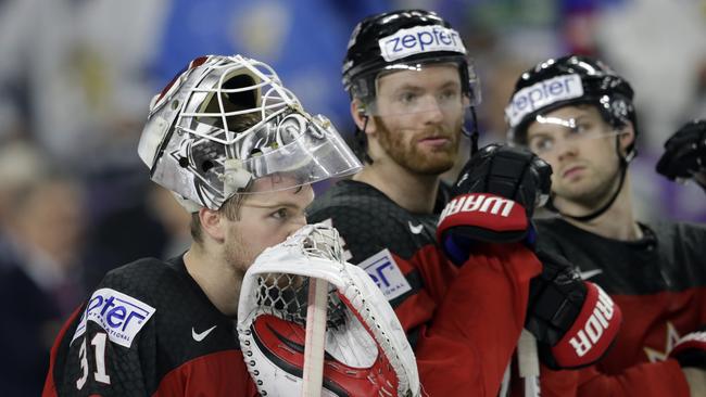 Canada's goalie Calvin Pickard, left, reacts in dejection after defeat in the Ice Hockey World Championships final match.