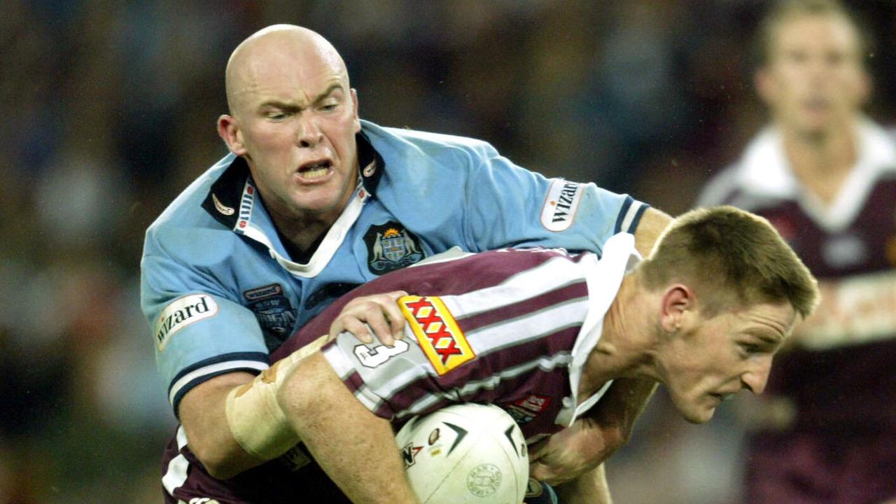 JUNE 11, 2003 : Ben Kennedy tackles Brent Tate during Game One of State of Origin RL match Queensland v NSW at Suncorp Stadium in Brisbane 11/06/03. Pic David Kapernick. Rugby League A/CT