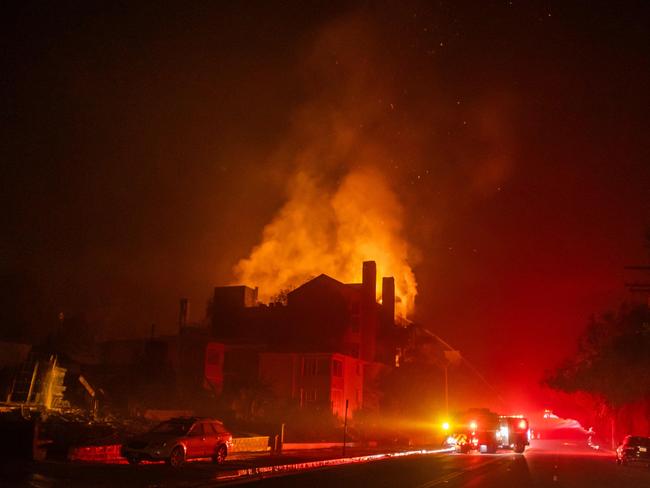 Flames from the Palisades Fire burn a residential building on Sunset Boulevard amid a powerful windstorm. Picture: Apu Gomes/Getty Images via AFP