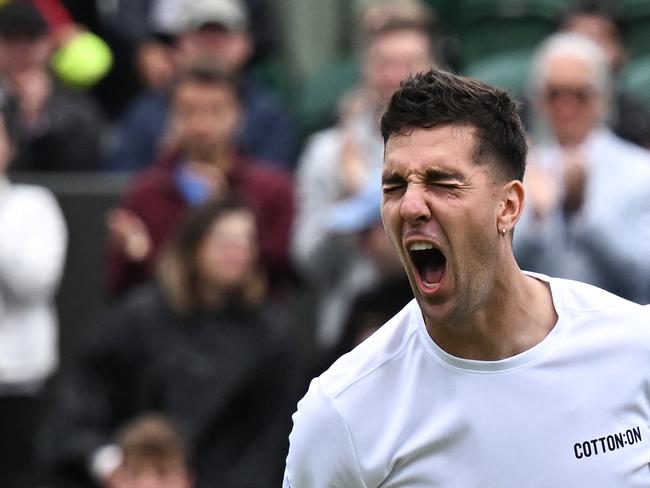 Australia's Thanasi Kokkinakis celebrates winning against Canada's Felix Auger-Aliassime during their men's singles first round tennis match on the third day of the 2024 Wimbledon Championships at The All England Lawn Tennis and Croquet Club in Wimbledon, southwest London, on July 3, 2024. (Photo by Ben Stansall / AFP) / RESTRICTED TO EDITORIAL USE