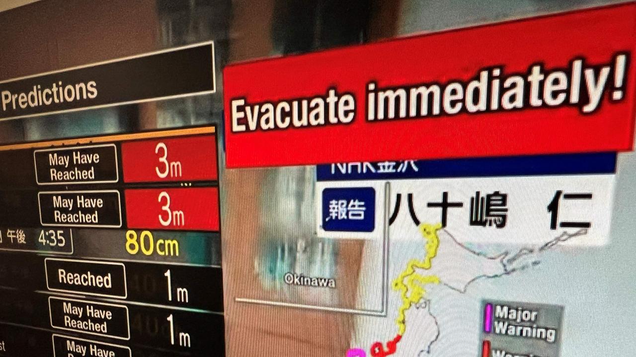 This image taken in Hong Kong shows a warning message on a screen from a live feed on NHK World asking people to evacuate from the area after a series of major earthquakes hit central Japan. Picture: AFP