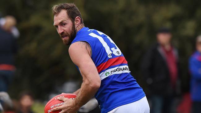 Travis Cloke takes possession for Footscray during a VFL match.