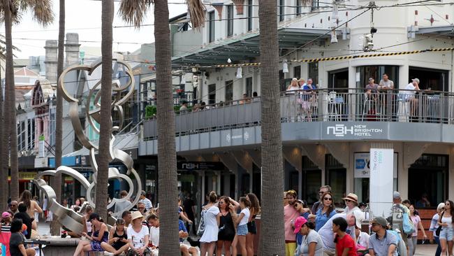 People in Manly's Corso today. Picture by Damian Shaw