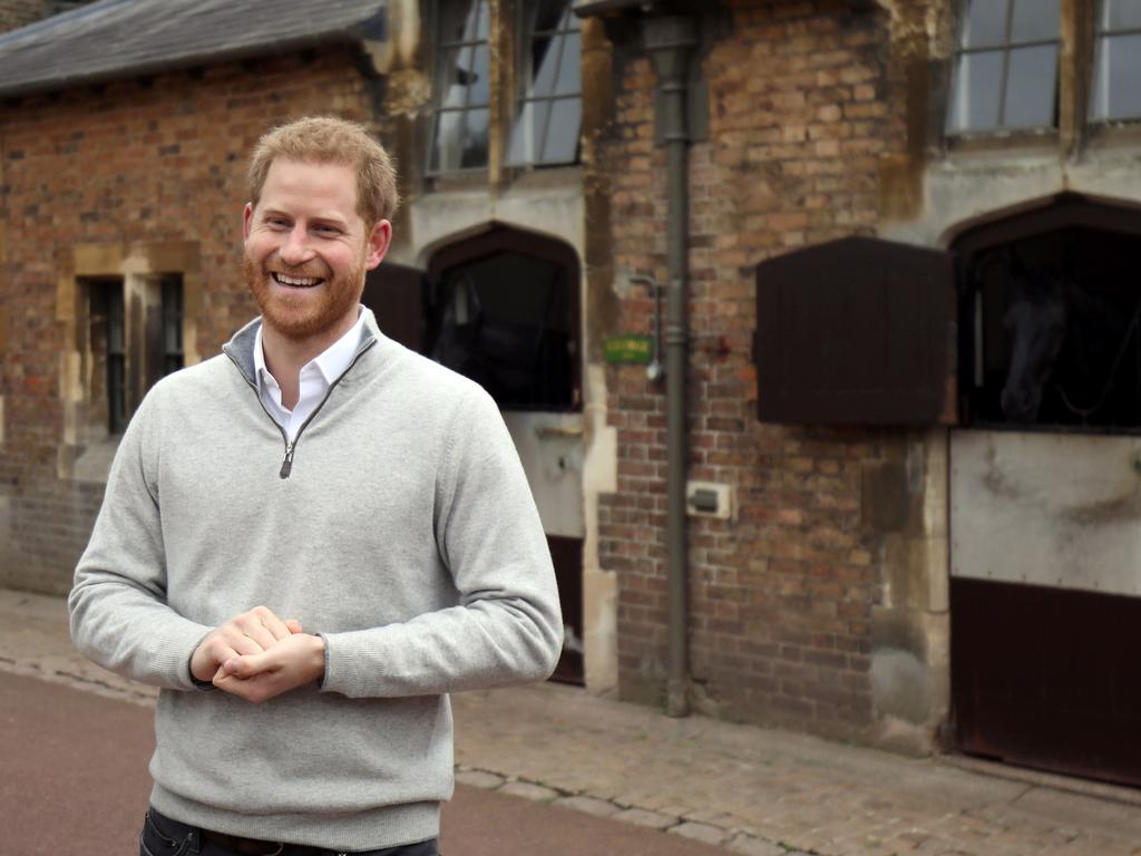 Harry with his two equine co-stars in the background. Picture: Steve Parsons/AFP