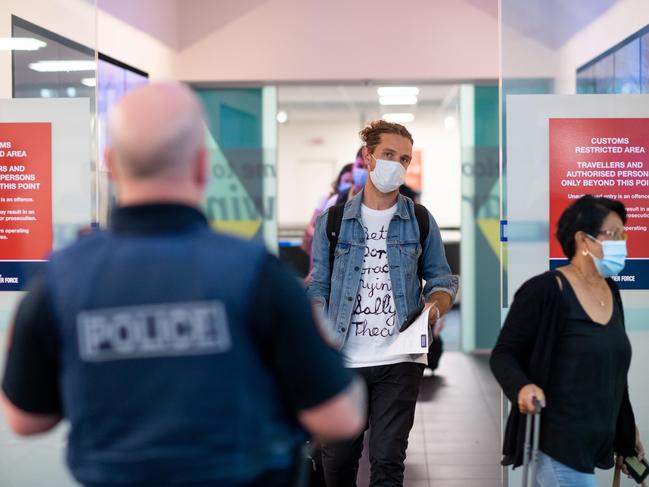 Two flights arriving to Darwin have been quarantined after the Northern Territory has once more closed its borders to South Australia. Passengers were in the air when the decision was made. QF860 and JQ692 arrived at Darwin Airport and passengers were given the option to return to Adelaide or quarantine for two weeks in Howard Springs. Picture: Che Chorley