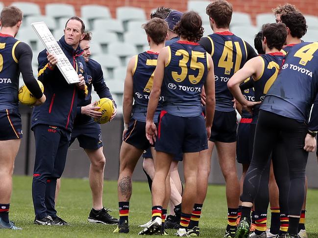 Don Pyke talks to his players at the start of an open training session at Adelaide Oval on July 17, 2019. Picture Sarah Reed