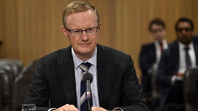 New Reserve Bank of Australia Governor Philip Lowe sits at a table for a parliamentary economics committee hearing in Sydney on September 22, 2016. (AFP PHOTO/PETER PARKS)