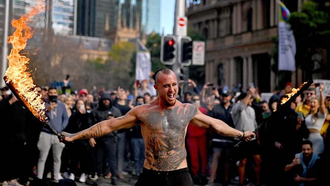 A man performs in front of a crowd in Sydney. Picture: Steven Saphore/AFP