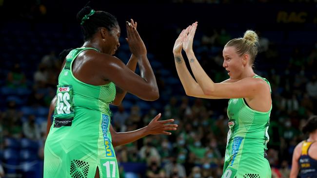 PERTH, AUSTRALIA - MARCH 27: Sasha Glasgow of the fever and Jhaniele Fowler of the fever high five after the 1st quarter during the round one Super Netball match between West Coast Fever and Sunshine Coast Lightning at RAC Arena, on March 27, 2022, in Perth, Australia. (Photo by James Worsfold/Getty Images)