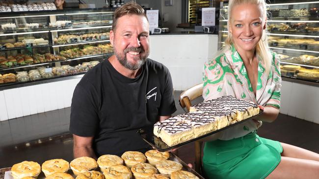 Damian Obst and his life/business partner Kate Reynolds with their popular (and delicious) chunky pies and vanilla slices. Picture: Dean Martin