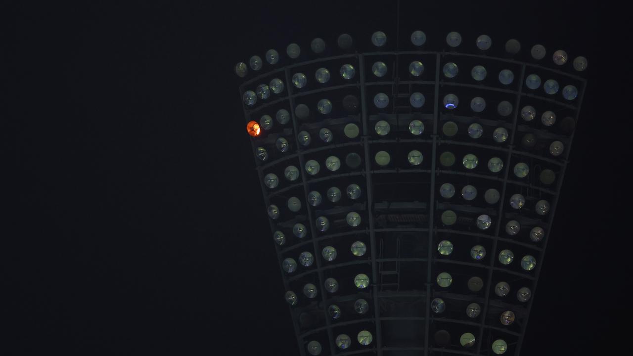 A fire can be seen flickering in one of the light towers at the Gabba. Picture: Chris Hyde/Getty Images