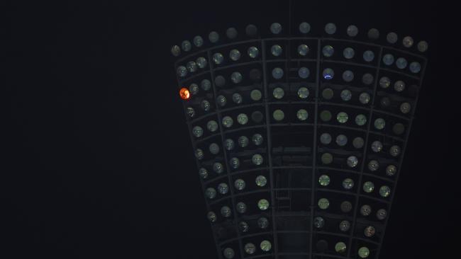 A fire can be seen flickering in one of the light towers at the Gabba. Picture: Chris Hyde/Getty Images