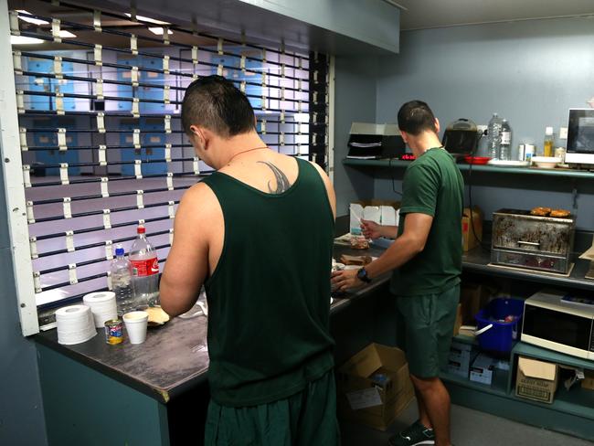 Prisoners cook Devil chicken wings on the toaster in D Block. Picture: Adam Taylor