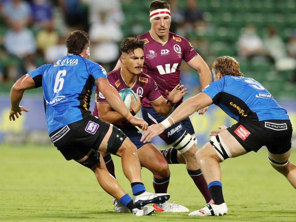 Jordan Petaia (centre) has been moved from wing to fullback for the Reds. Picture: Will Russell/Getty Images