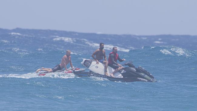 Surfers, Mick Fanning and Joel Parkinson using a jetski to catch waves at Snapper Rocks on Sunday 2 January 2022. Picture: Jerad Williams