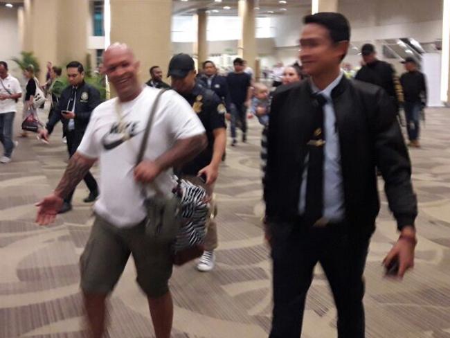 Kosh Radford being escorted back to a plane in Denpasar airport. Picture: Supplied