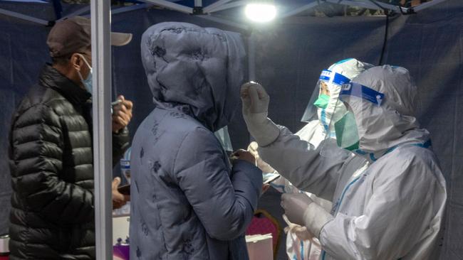 A resident undergoes a nucleic acid test for Covid-19 in Xi’an in China's northern Shaanxi province on Tuesday. Picture: AFP