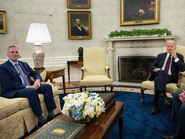 (FILES) US President Joe Biden looks on during a meeting with US Speaker of the House Kevin McCarthy (R-CA) in the Oval Office of the White House in Washington, DC, on May 9, 2023. President Joe Biden and House Speaker Kevin McCarthy will meet on May 22, 2023, for more talks on defusing the US debt ceiling standoff, both sides said on May 21, 2023. (Photo by Brendan Smialowski / AFP)