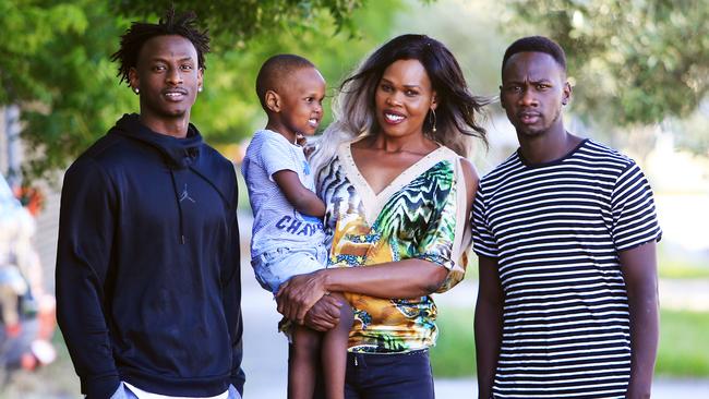 Aluel Kuol with her sons (L-R) Bolis Daw (18), Aleu Deng (3) and Deng Daw (23). She arrived in Australia from South Sudan in 2008 and is a leader in the local Sudanese Dinka community. (Pic: Aaron Francis/The Australian)