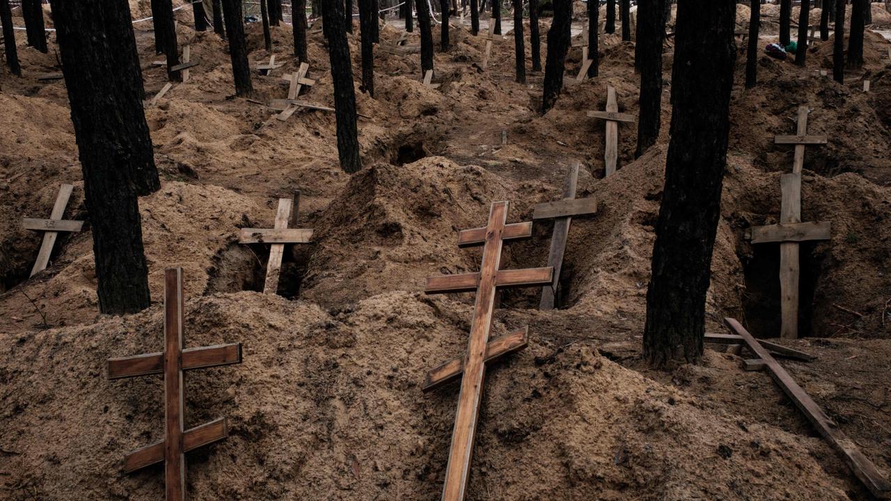 Empty graves after exhumation of bodies in the mass grave created during the Russian's occupation in Izyum, Kharkiv region, amid the Russian invasion of Ukraine. Photo: Yasuyoshi Chiba