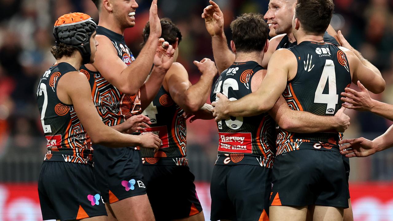 SYDNEY, AUSTRALIA - JULY 06: Jesse Hogan of the Giants celebrates kicking a goal with team mates during the round 17 AFL match between Greater Western Sydney Giants and Carlton Blues at ENGIE Stadium, on July 06, 2024, in Sydney, Australia. (Photo by Brendon Thorne/AFL Photos)