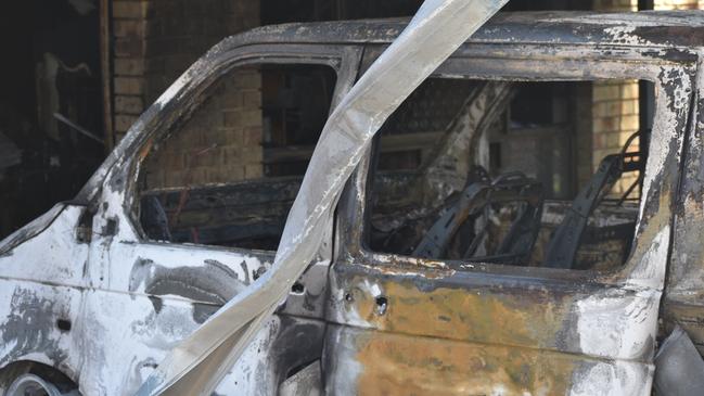 The vehicles in the carport were completely torched and gutted following the fire at Cromwell St.