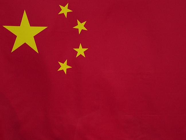 The national flag of China is seen during the awarding ceremony of the women's 200m butterfly final at the Tokyo 2020 Olympic Games in Tokyo, Japan, July 29, 2021. (Photo by Xu Chang/Xinhua via Getty Images)