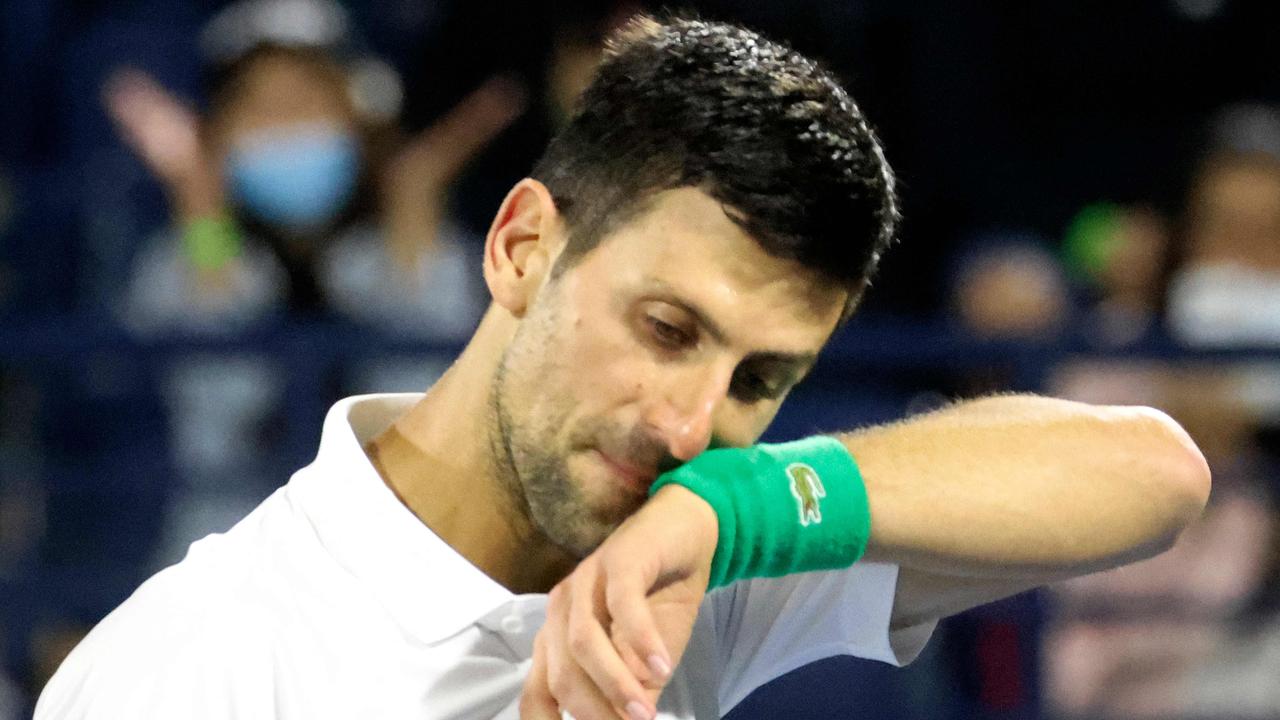 Serbia's Novak Djokovic reacts to his defeat by Czech Republic's Jiri Vesely during their quarter-final match at the ATP Dubai Duty Free Tennis Championship, in the Gulf emirate on February 24, 2022. (Photo by Karim SAHIB / AFP)